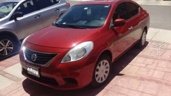 Nissan versa a/c excelente estado -12